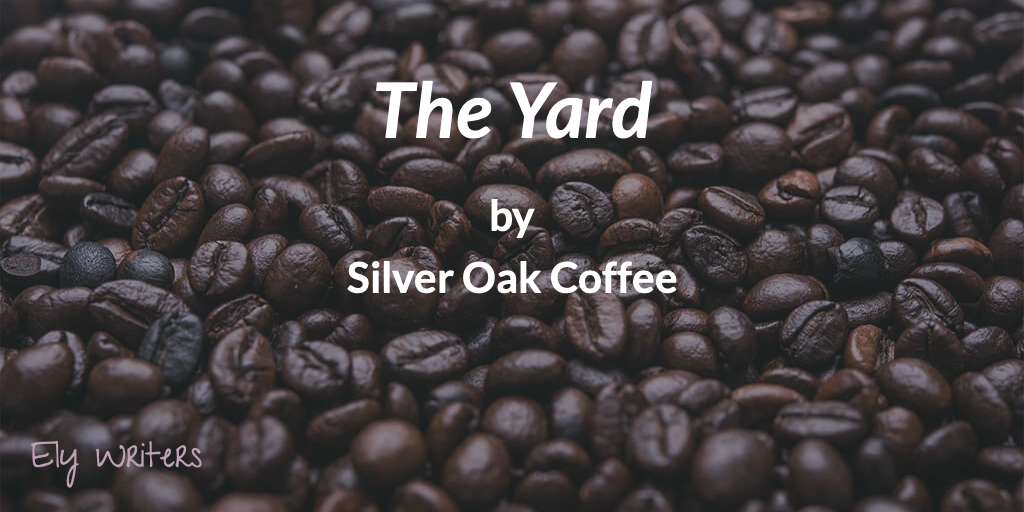 A background of coffee beans with text: 'The Yard by Sil ver Oak Coffee. Ely Writers."